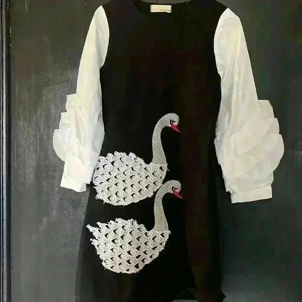 Amazing wool dress with cotton sleeves size small would  fit 2-6. Stretchy wool